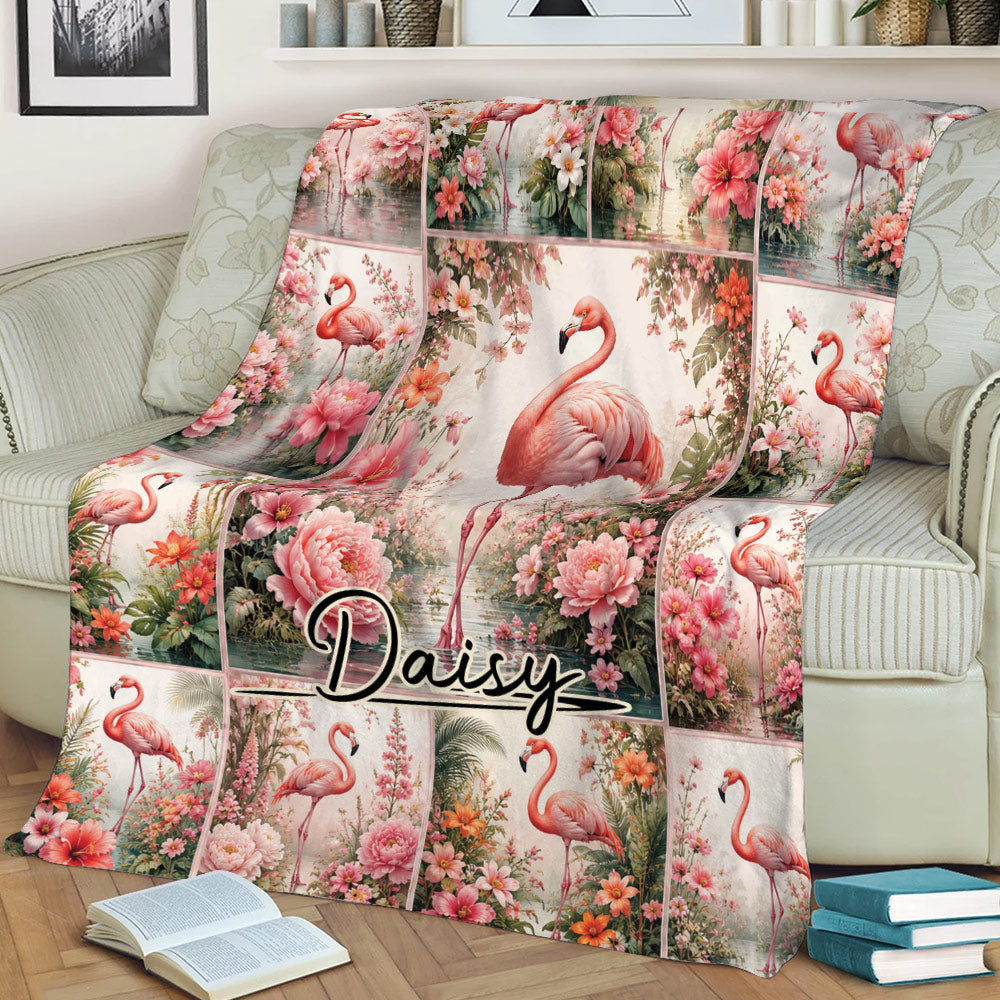 Flamingo blanket draped over a sofa, featuring a central flamingo surrounded by vibrant flowers