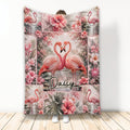 Flamingo throw blanket with tropical flowers, paired flamingos, and pink botanical artwork