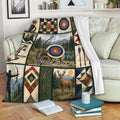 Archery throw blanket displayed on a sofa with bow, arrow, target, mountain, and woodland artwork