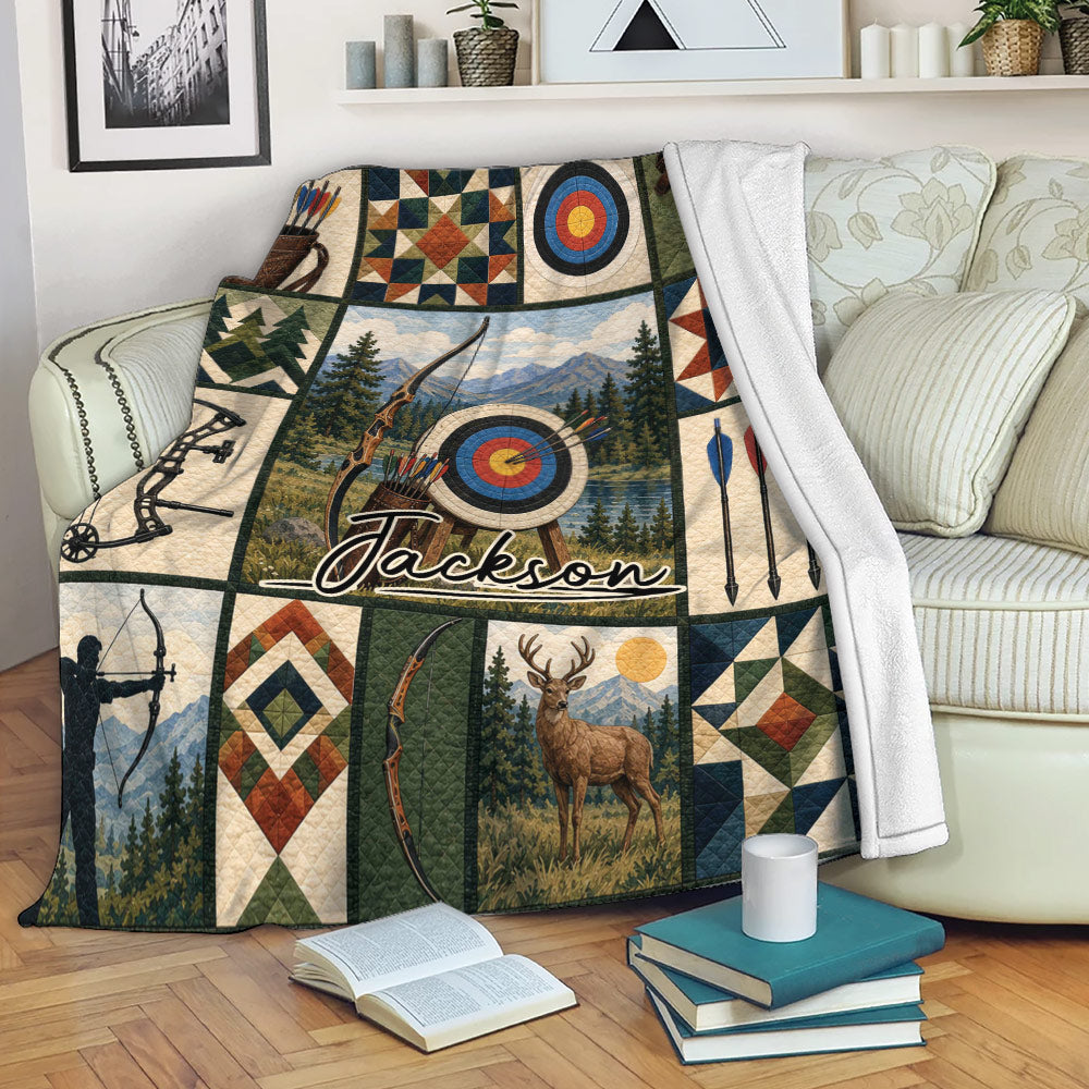 Archery throw blanket displayed on a sofa with bow, arrow, target, mountain, and woodland artwork