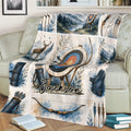 Close view of an archery throw blanket on a sofa with target, bows, arrows, and scenic artwork