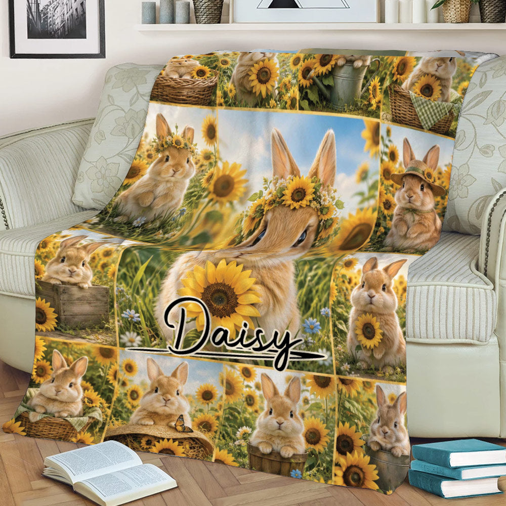 Rabbit and sunflower throw blanket styled across a living room sofa