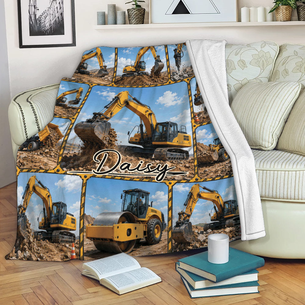 Excavator throw blanket displayed on a sofa with detailed construction equipment collage design