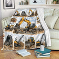 Excavator throw blanket draped over a sofa with yellow construction equipment artwork