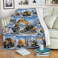Excavator throw blanket draped over a sofa with snowy construction artwork