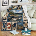 Pontoon boat throw blanket draped over a sofa with lake scenery, fishing, and nautical boating artwork