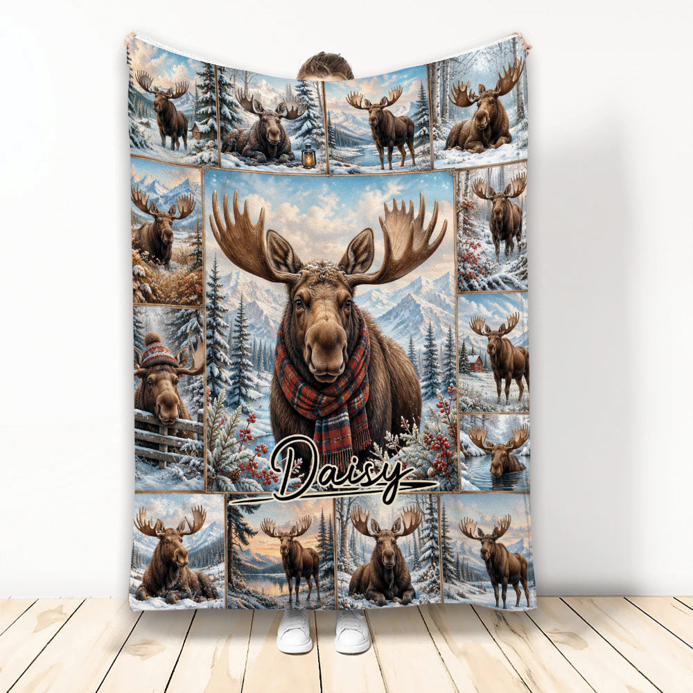 Moose throw blanket displayed upright with snowy mountain scenes, evergreen trees, and rustic woodland artwork