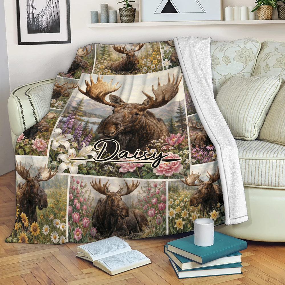Floral moose throw blanket draped over a sofa in a cozy living room setting
