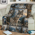 Wolf throw blanket styled on a couch with detailed wolf portraits, mountain scenery, evergreen forests, and lake views