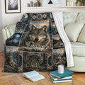 Wolf throw blanket draped over a sofa, featuring mountain landscapes, moonlit wolf scenes, and rustic artwork