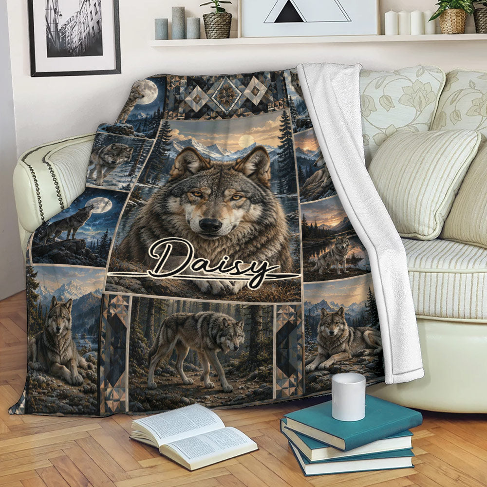 Wolf throw blanket draped over a sofa, featuring mountain landscapes, moonlit wolf scenes, and rustic artwork