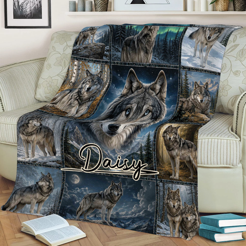 Wolf throw blanket styled on a couch with dramatic wildlife artwork, moonlit mountains, and multiple wolf portraits