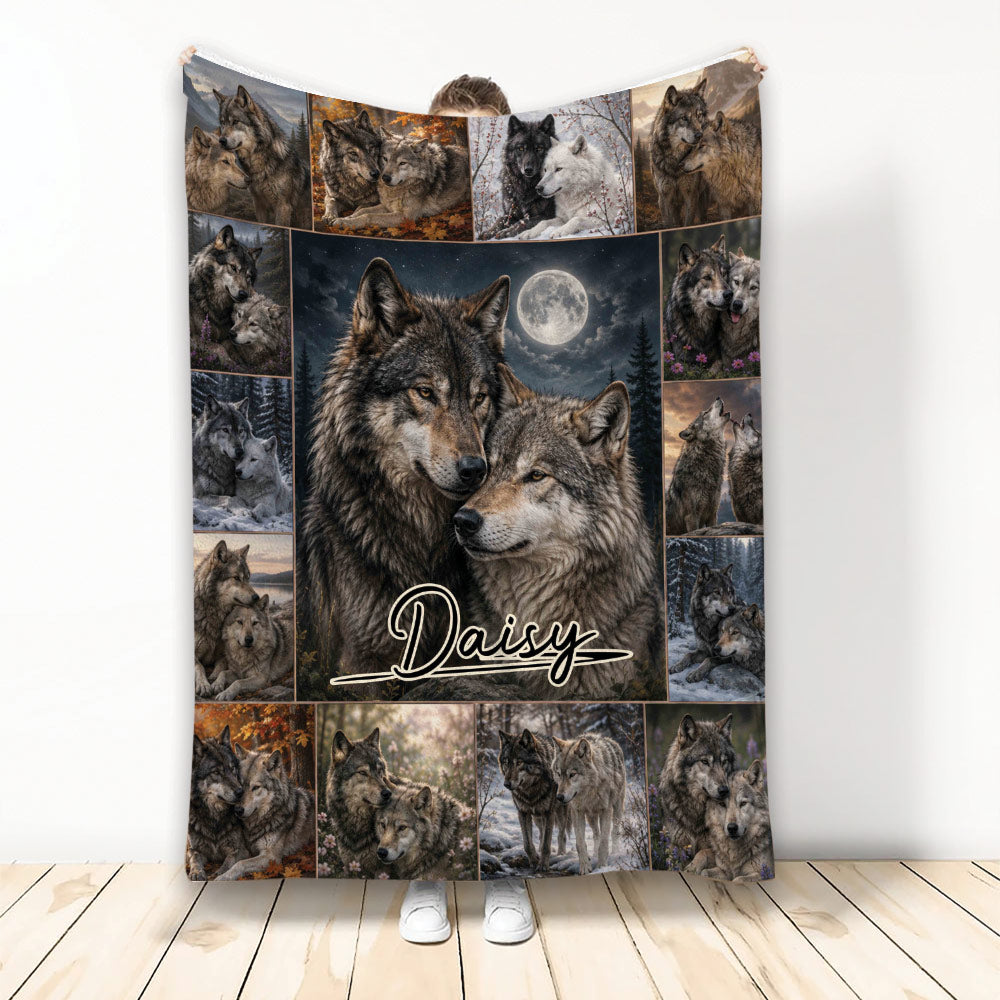 Wolf throw blanket with a moonlit pair of wolves surrounded by seasonal wildlife collage panels