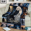 Cozy sofa display featuring a wolf throw blanket with moonlight, forest scenes, and paired wolves