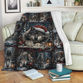 Custom Christmas wolf blanket draped over a sofa with snowy woodland artwork