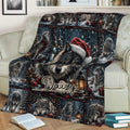 Wolf throw blanket displayed on a sofa with festive winter forest and lantern details