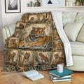 Tiger throw blanket draped over a sofa with a detailed jungle wildlife collage design