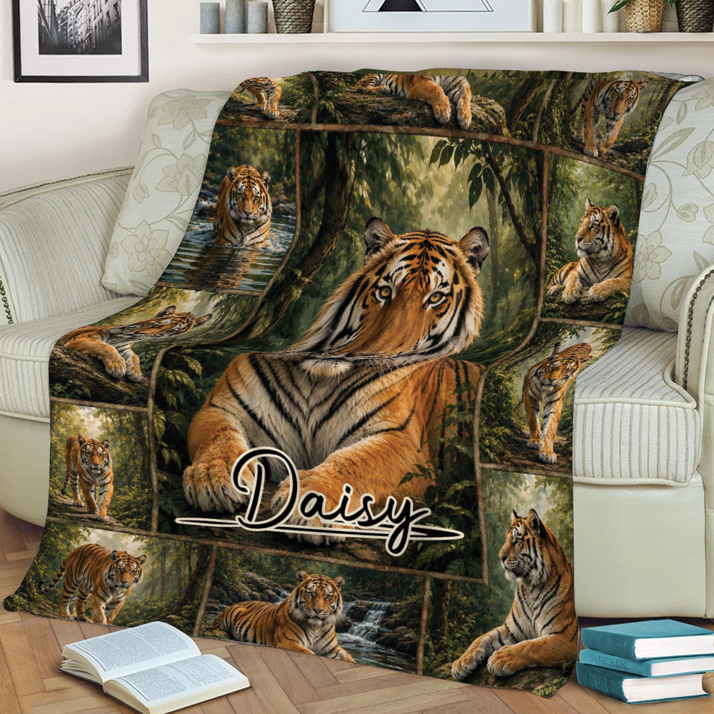 Tiger blanket spread across a couch featuring multiple tigers surrounded by dense forest artwork