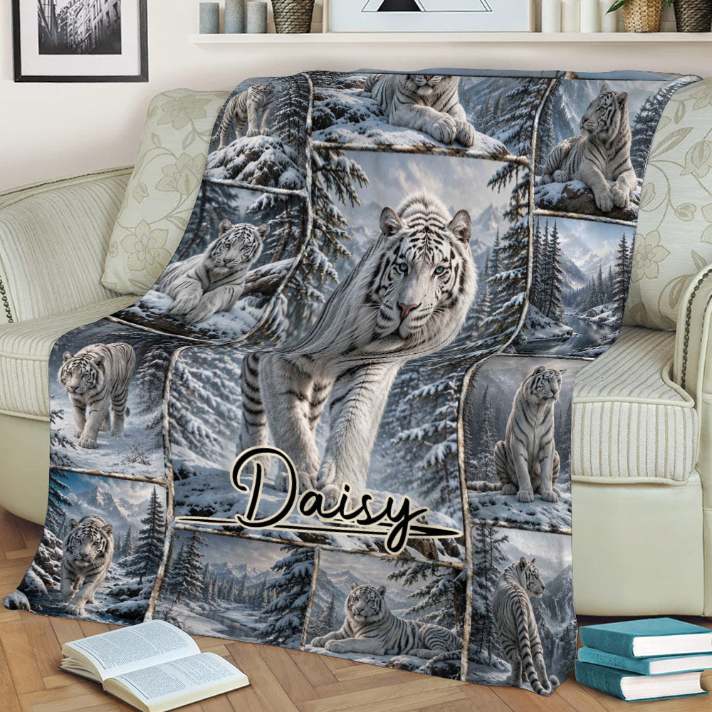 Tiger throw blanket displayed on a couch with white tiger and winter forest artwork