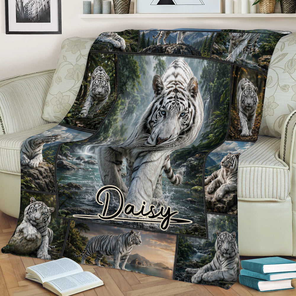 White tiger blanket displayed across a sofa with detailed forest and mountain artwork