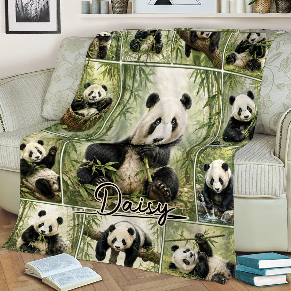 Panda throw blanket displayed on a couch with a central panda and bamboo artwork