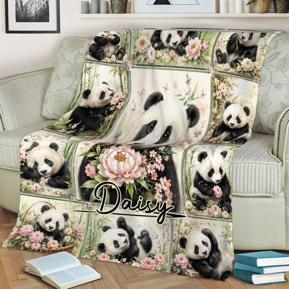 Panda throw blanket spread across a sofa with blooming flowers, bamboo, and playful panda scenes