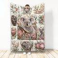 Koala throw blanket featuring multiple koalas, Australian flowers, leafy botanicals, and a custom design