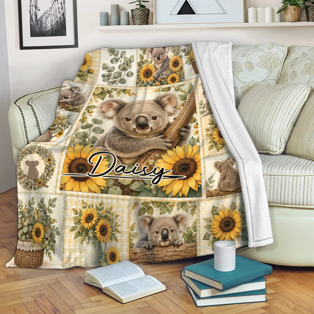 Koala and sunflower throw blanket draped over a living room sofa