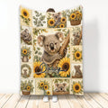 Koala throw blanket with sunflower collage artwork displayed upright