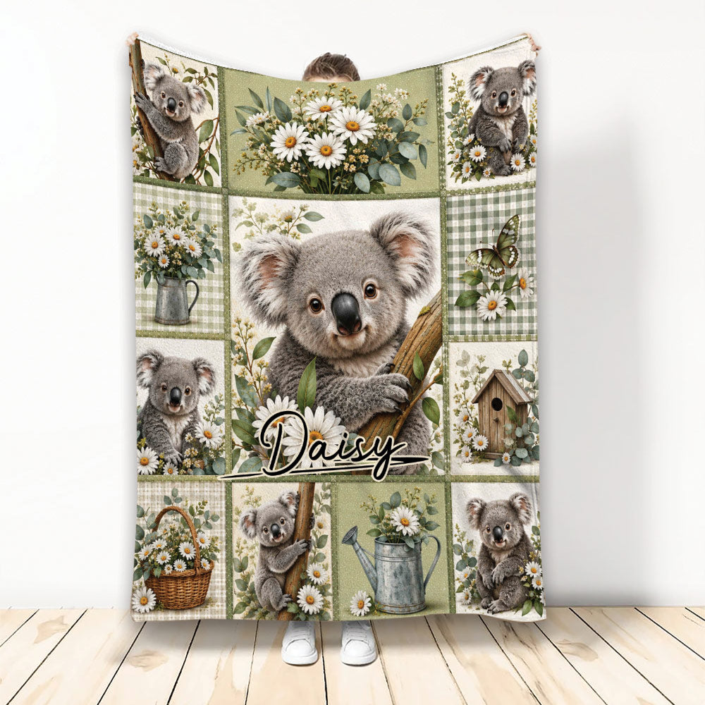 Koala throw blanket featuring a central koala surrounded by daisies, greenery, and garden-themed patchwork panels