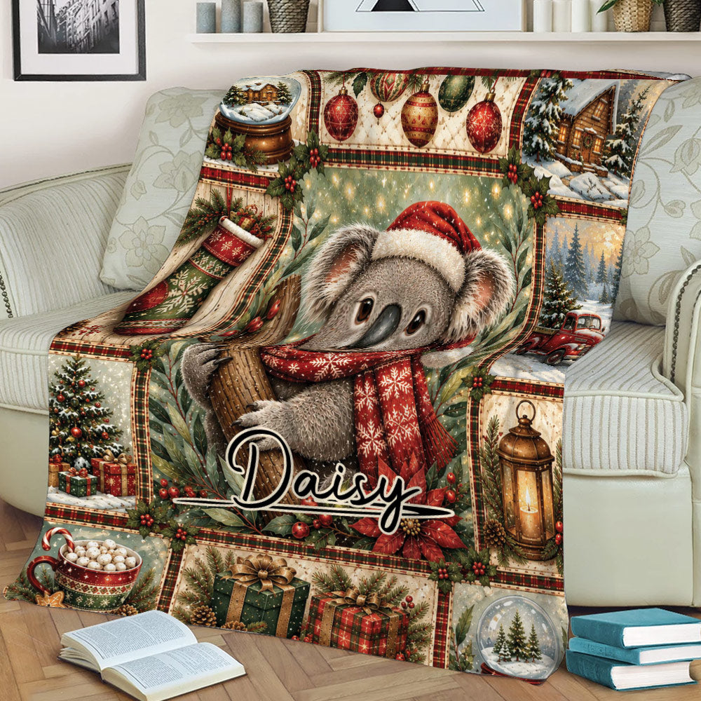 Close lifestyle view of a Christmas koala throw blanket with ornaments, gifts, greenery, and cozy holiday artwork