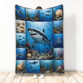 Shark throw blanket with underwater ocean scenes, coral reefs, seashells, and a large shark design