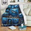 Shark throw blanket draped over a sofa with vivid underwater scenes and ocean life