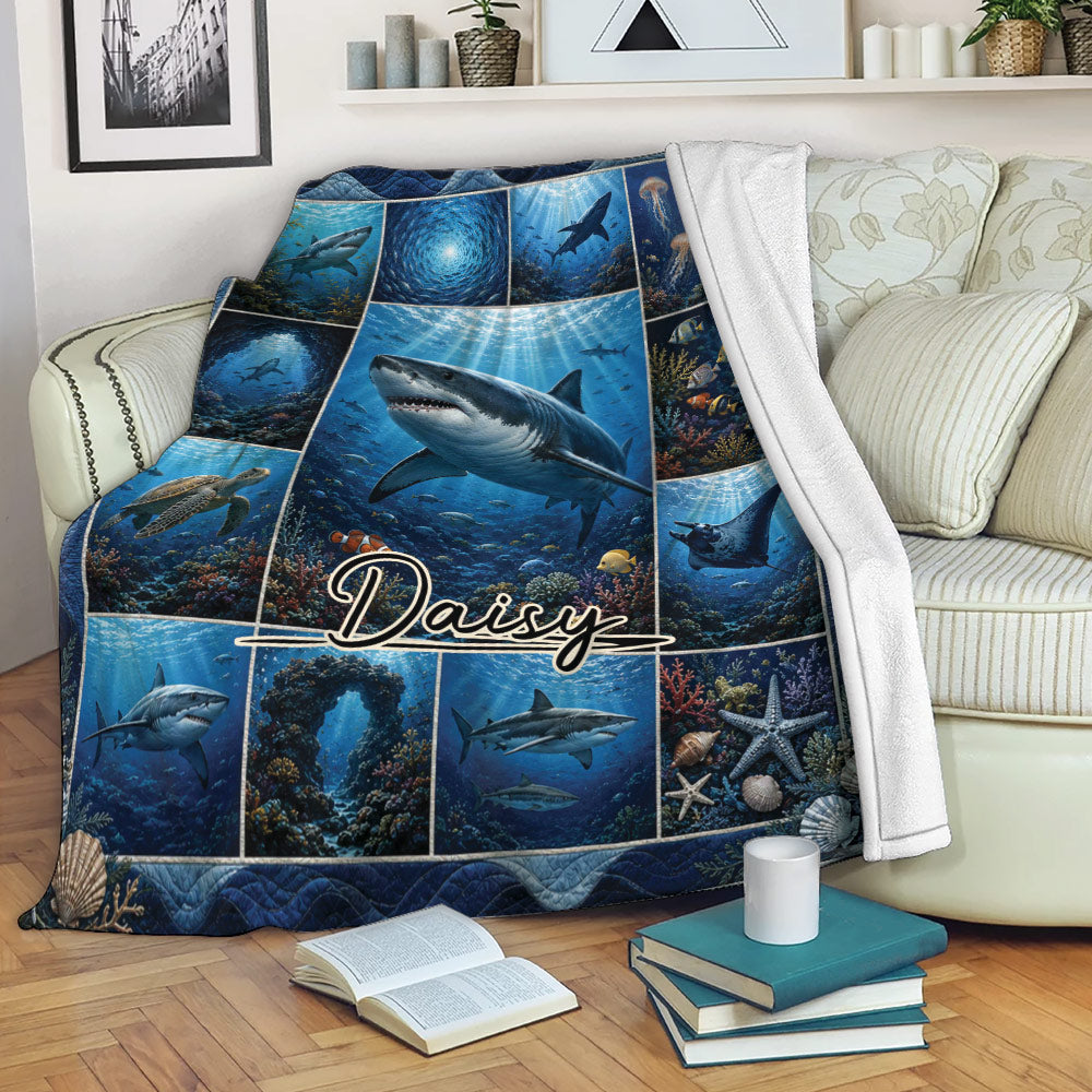 Shark throw blanket draped over a sofa with vivid underwater scenes and ocean life