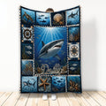 Shark throw blanket displayed upright with an underwater ocean scene, coral, fish, compass, and nautical details