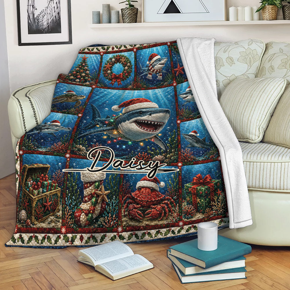 Christmas shark throw blanket draped over a sofa with colorful underwater holiday artwork