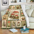 Mushroom throw blanket draped over a sofa, featuring vintage fungi illustrations and rustic woodland botanical panels