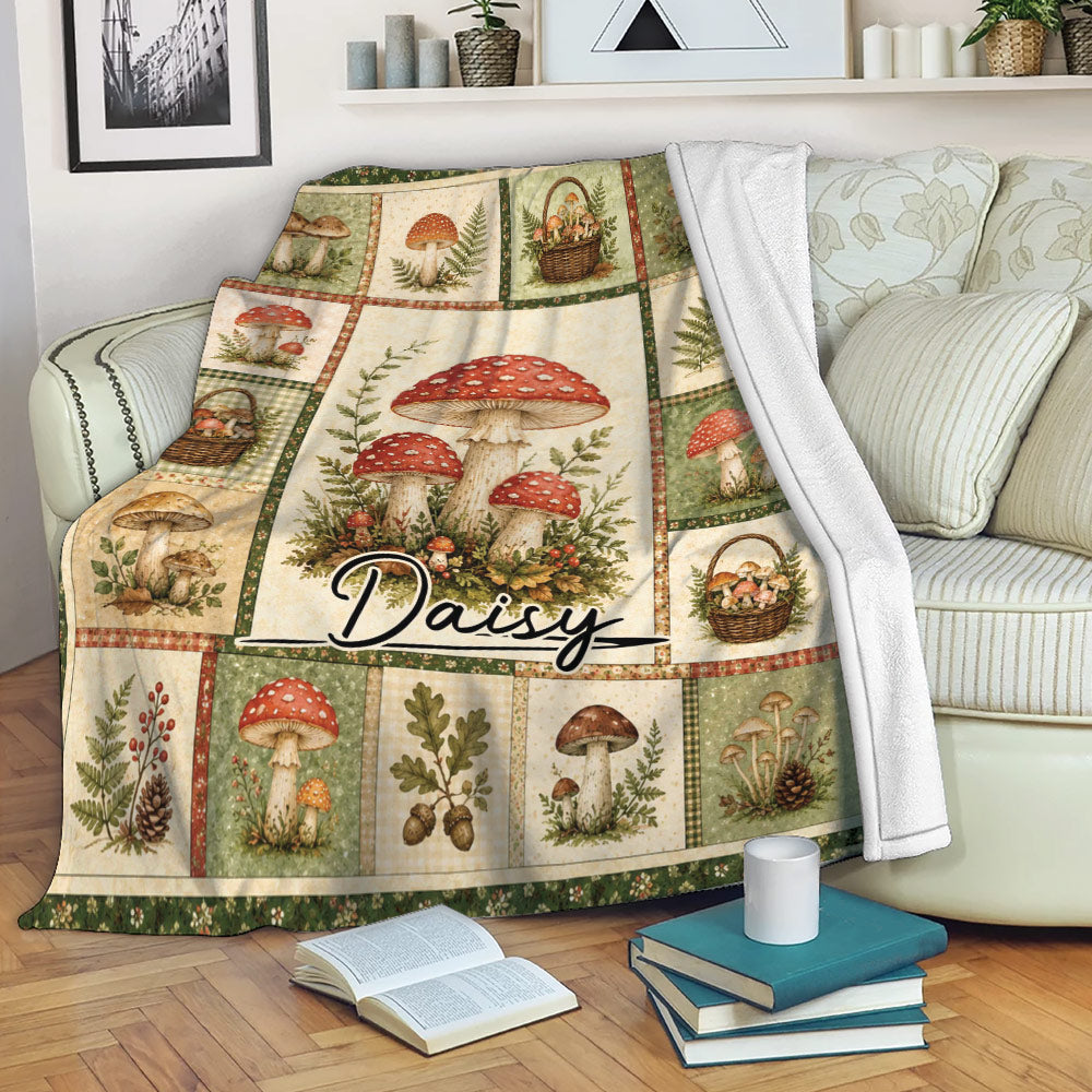Mushroom throw blanket draped over a sofa, featuring vintage fungi illustrations and rustic woodland botanical panels
