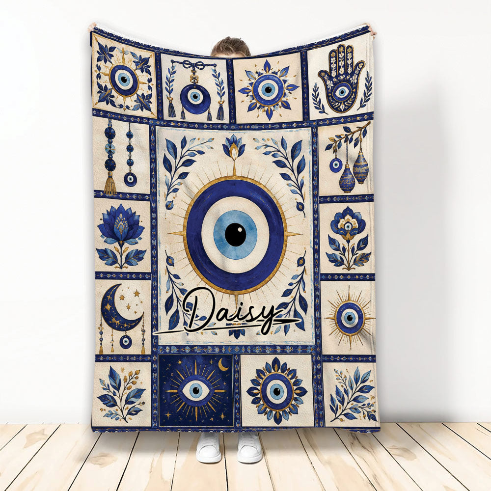 Evil Eye throw blanket displayed upright with blue nazar symbols, floral motifs, moon imagery, and decorative panels
