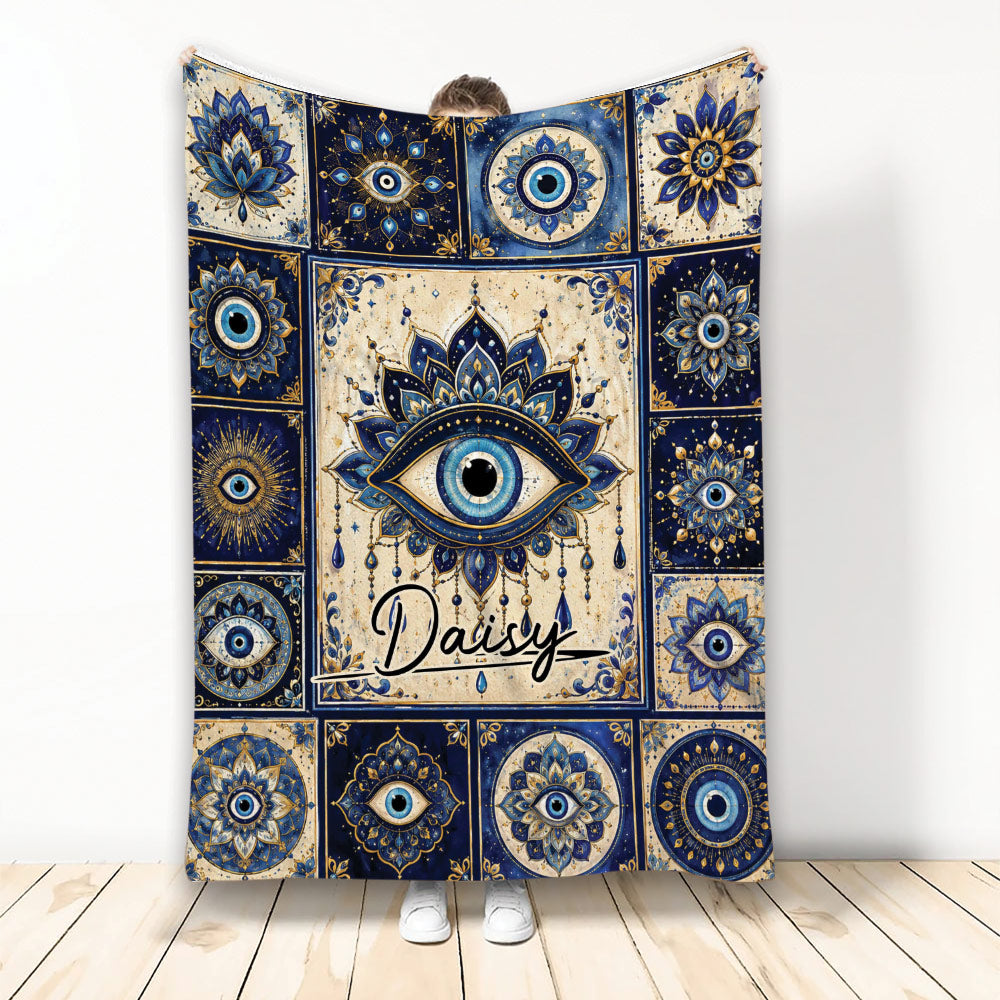 Blue and gold evil eye blanket with ornate mandala artwork displayed upright