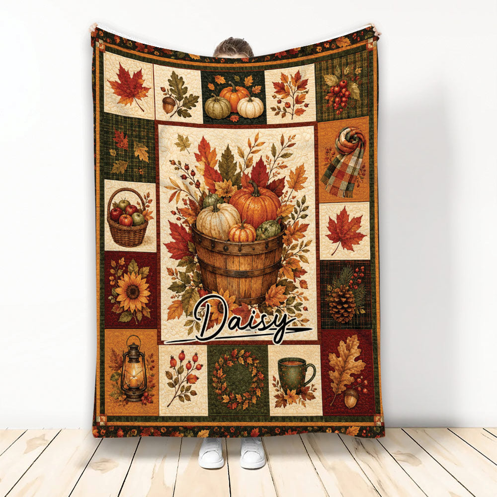 Autumn harvest blanket with pumpkins, fall leaves, acorns, apples, and warm rustic colors