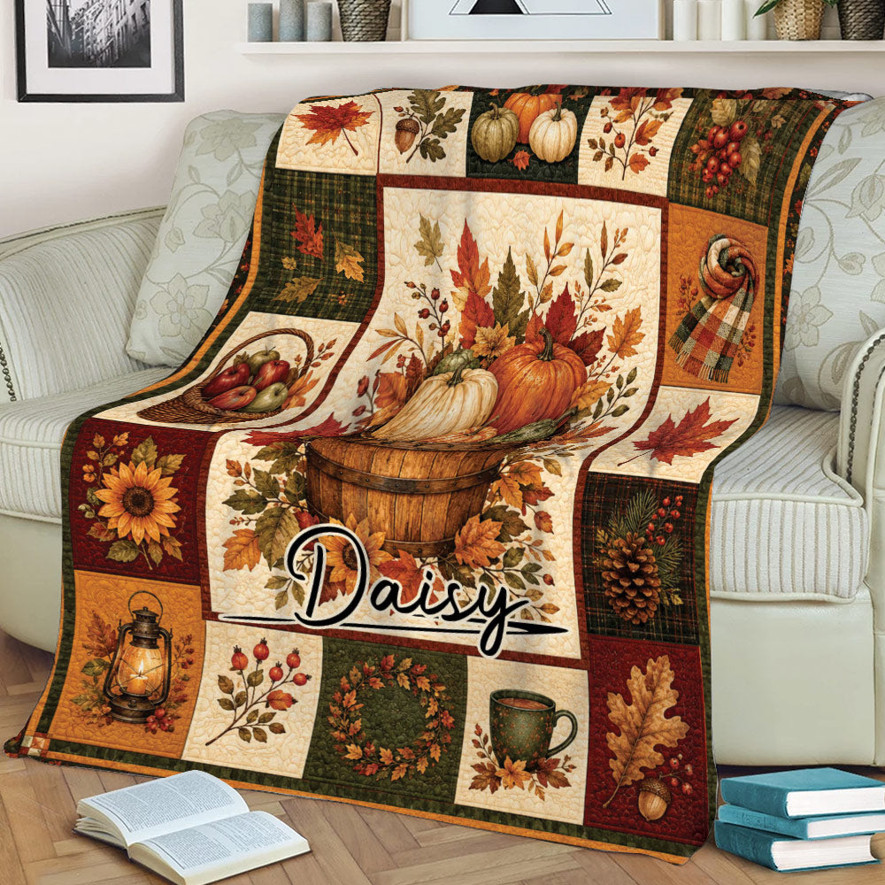 Fall pumpkin and leaf throw blanket displayed across a sofa in a cozy living room