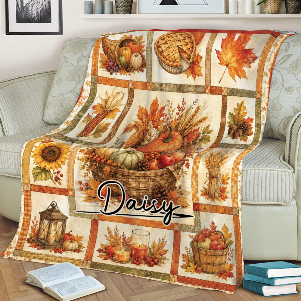 Autumn Thanksgiving throw blanket draped over a sofa with harvest basket, pumpkins, candles, and fall panels