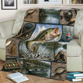 Fishing blanket draped over a chair featuring lake scenery, tackle, fishing rods and fish artwork