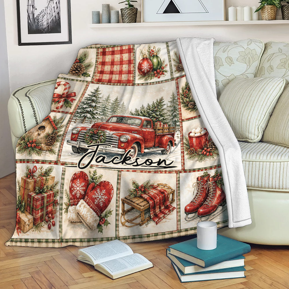 Christmas blanket draped over a sofa with vintage red truck, candy cane, ornaments, gifts, and winter holiday artwork