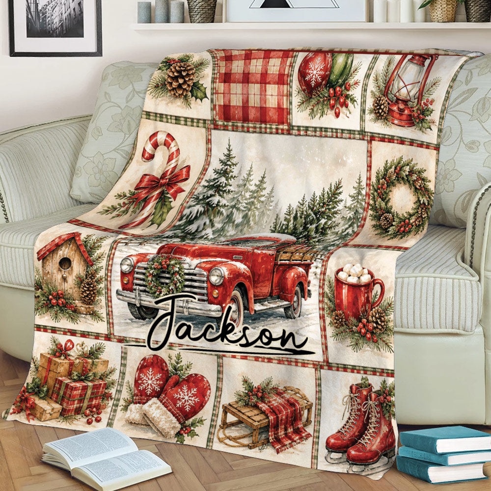 Christmas throw blanket styled on a couch with red vintage truck, snowy forest, wreath, mittens, gifts, and skates