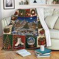 Christmas throw blanket draped over a sofa with snowy village and festive plaid holiday scenes