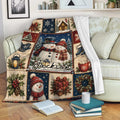Rustic Christmas throw blanket featuring snowmen and festive winter artwork draped over a living room sofa
