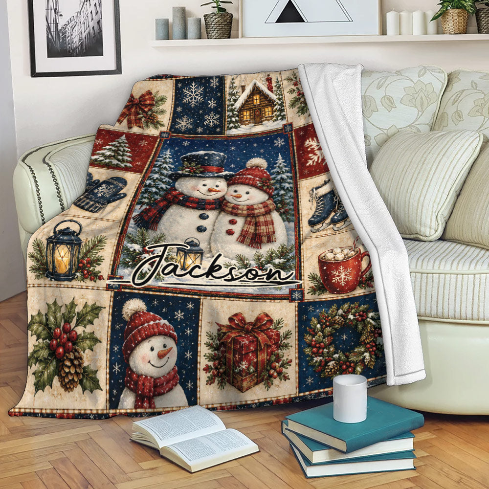 Rustic Christmas throw blanket featuring snowmen and festive winter artwork draped over a living room sofa