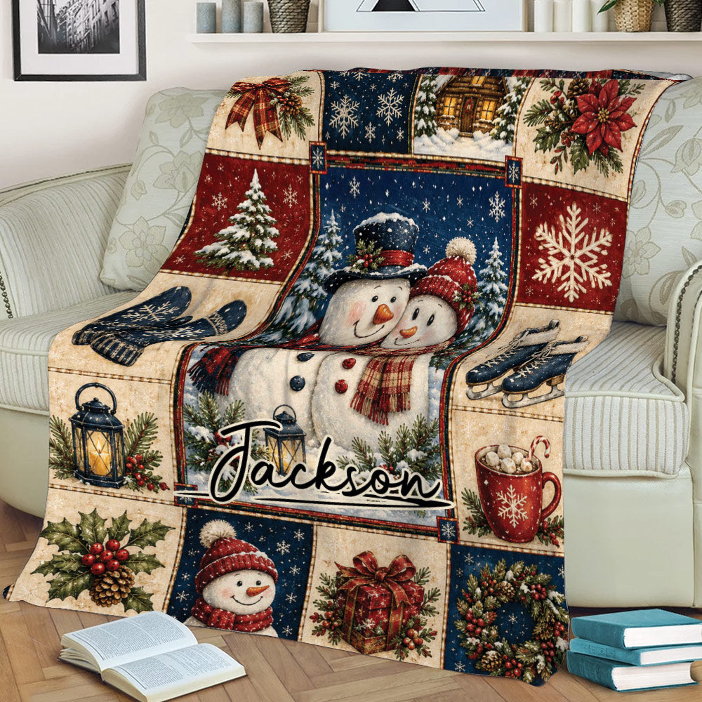 Christmas snowman throw blanket displayed on a sofa with snowflakes, lanterns, gifts, and holiday greenery